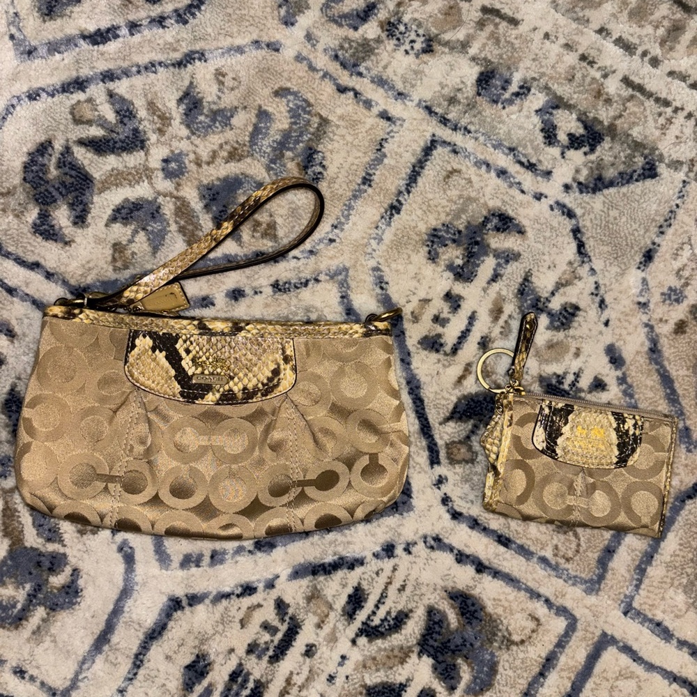 Small snakeskin embellished coach cardholder.
